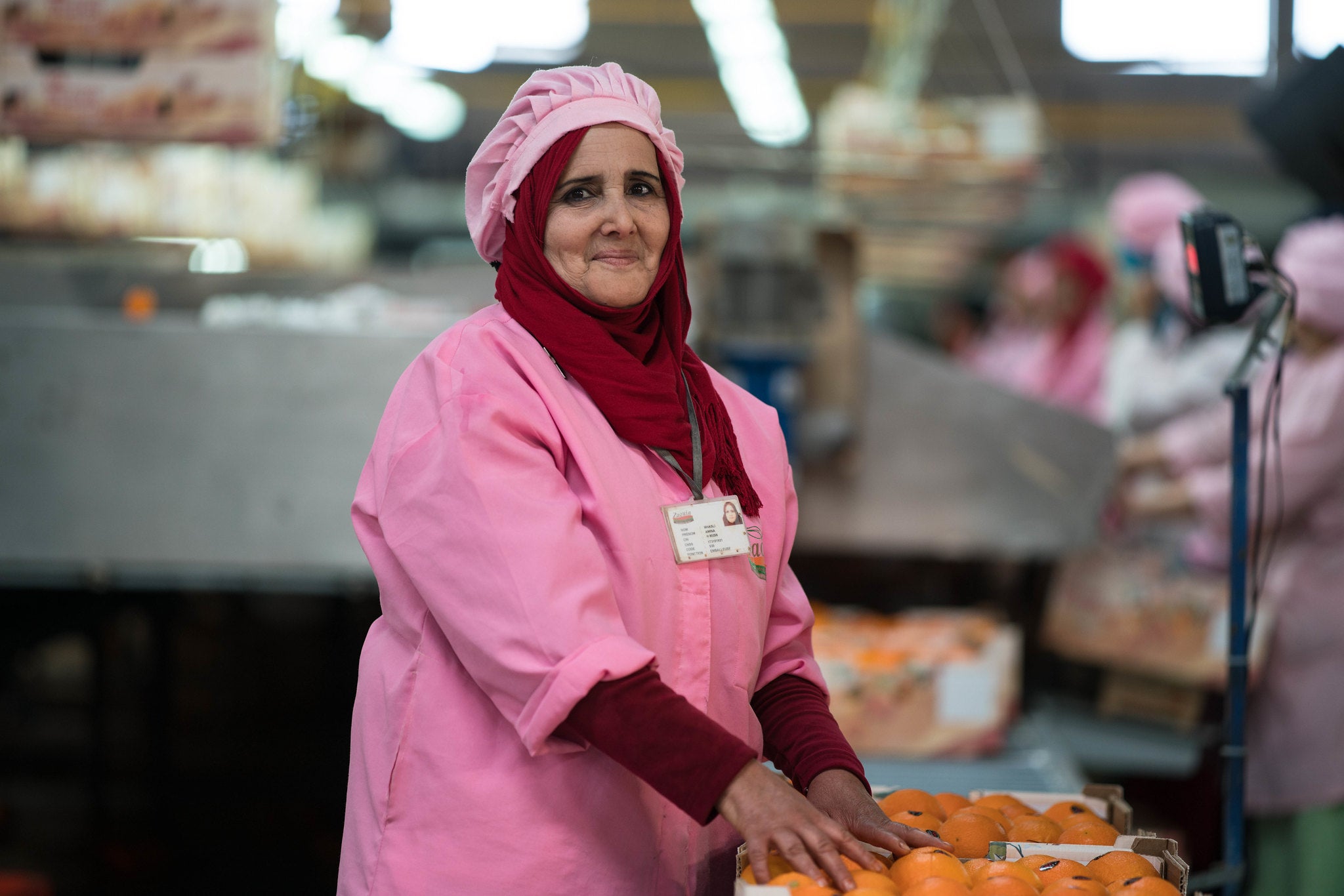 Guerdane Irrigation PPP Project: Amina Mhasli, an employee at the Guerdane citrus processing factory, packaging oranges in Guerdane, Morocco