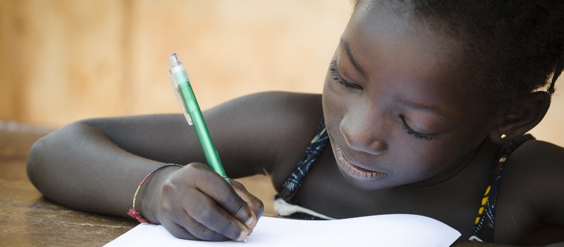 Girl at school writing 